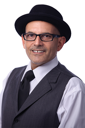 Bruce Schwartz dons a pork pie hat and is known as the “Detroit Relocation Ambassador.”